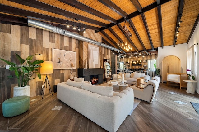 living area featuring wood finished floors, wood walls, and wooden ceiling