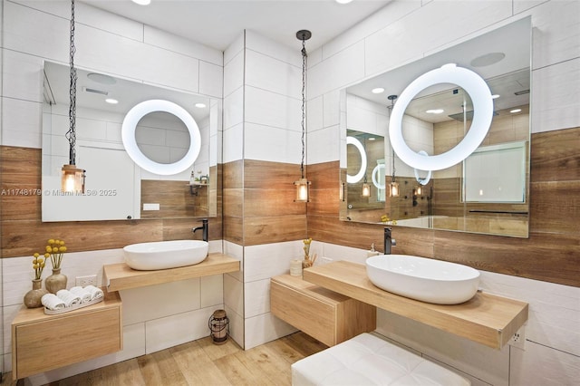 bathroom with vanity and wood finished floors