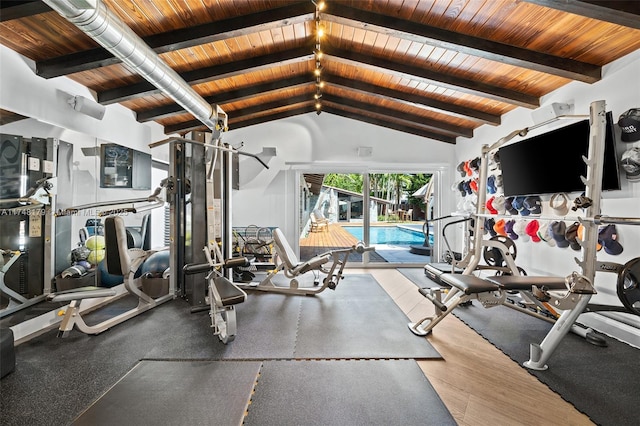 exercise room featuring vaulted ceiling and wood ceiling