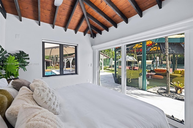 bedroom featuring lofted ceiling with beams, wood ceiling, and access to outside