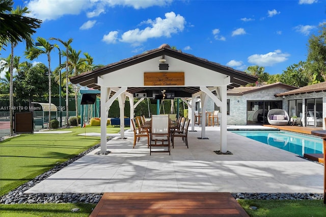 outdoor pool featuring a gazebo, a patio area, and fence