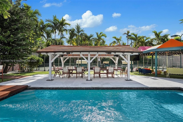 view of pool featuring a gazebo, a fenced in pool, a patio, and fence