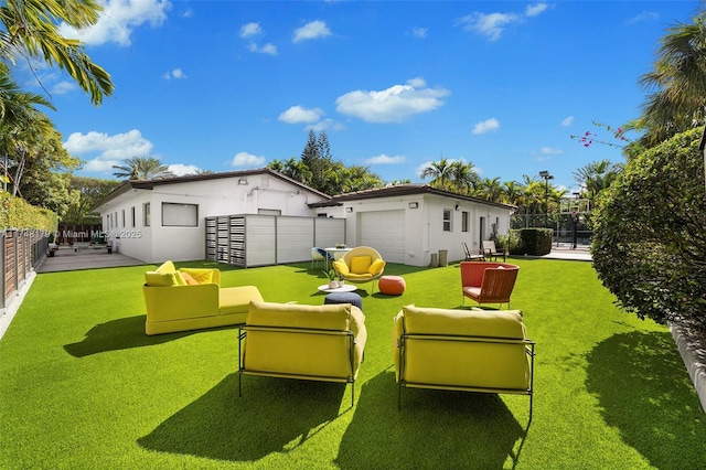 view of yard with a garage and fence