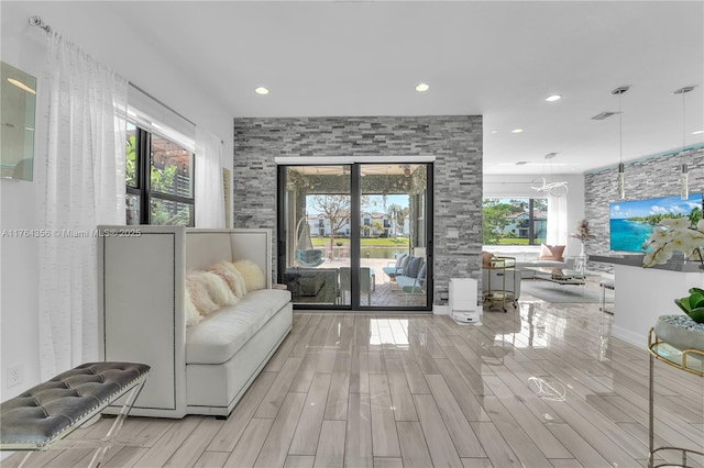 living area with visible vents, recessed lighting, french doors, and wood finish floors