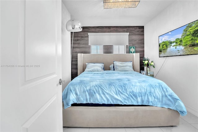 tiled bedroom with an accent wall