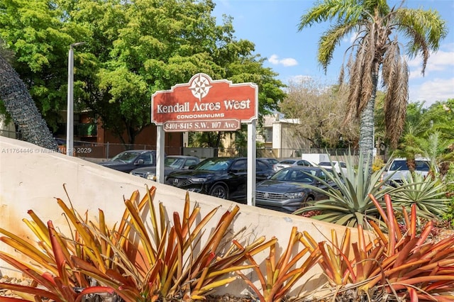 exterior space with uncovered parking and fence