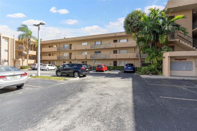 view of property with uncovered parking