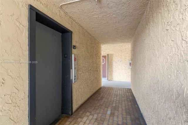 hallway featuring elevator