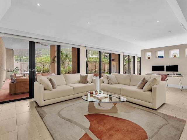 living room featuring recessed lighting and baseboards