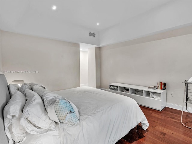 bedroom featuring recessed lighting, wood finished floors, visible vents, and baseboards