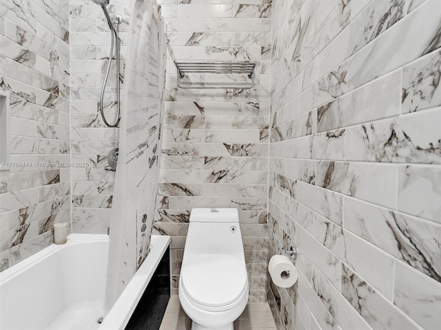 full bath featuring tile walls, toilet, and shower / bathtub combination with curtain