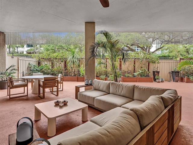 view of patio featuring outdoor dining space, a fenced backyard, and an outdoor hangout area