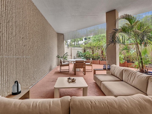 view of patio / terrace with outdoor lounge area and fence