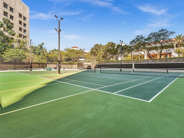 view of sport court with fence