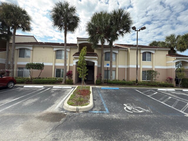 815 W Boynton Beach Blvd Unit 6-103, Boynton Beach, FL 33426 - view of property with uncovered parking