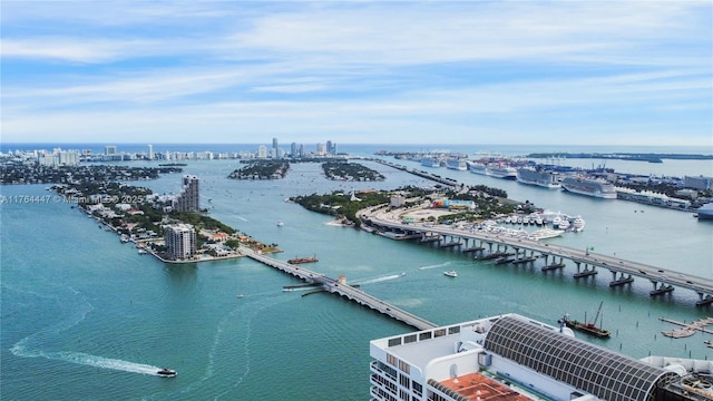 birds eye view of property featuring a view of city and a water view