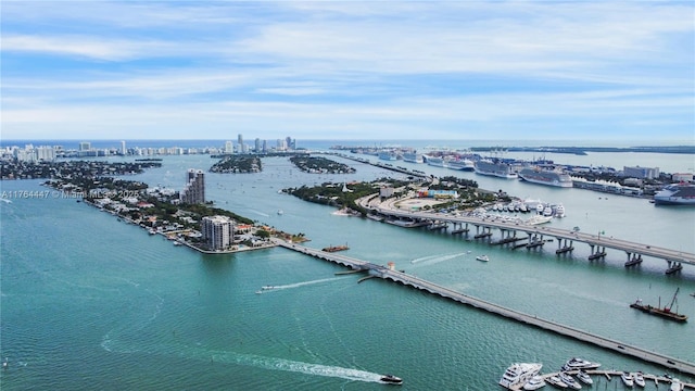 birds eye view of property with a view of city and a water view