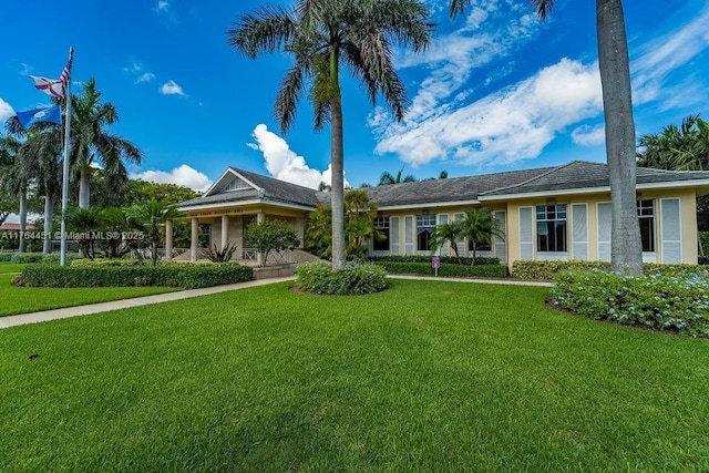 ranch-style house featuring a front lawn