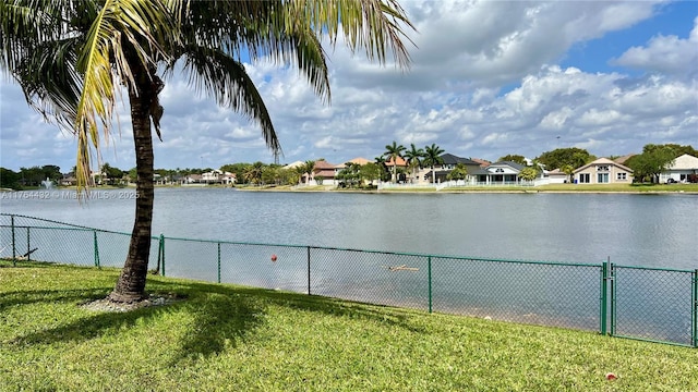 water view featuring fence and a residential view