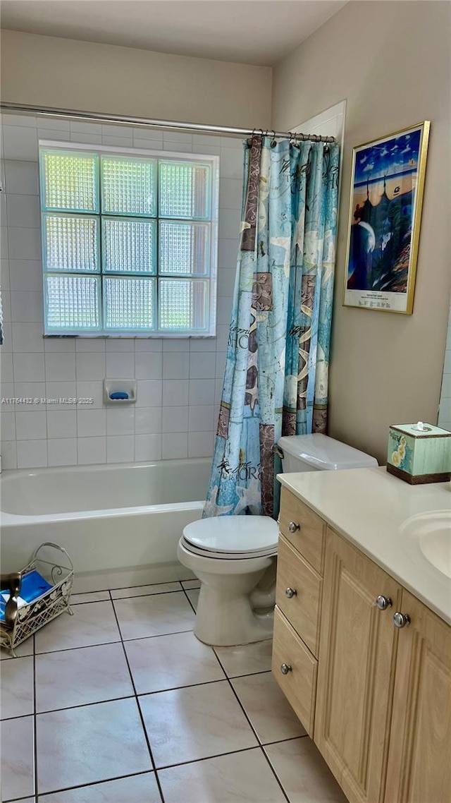 bathroom with tile patterned floors, shower / tub combo with curtain, toilet, and vanity