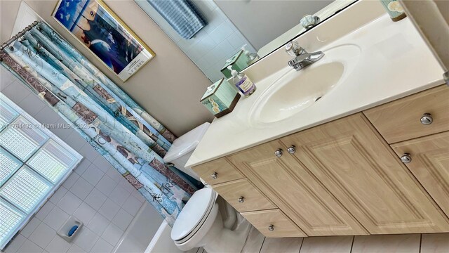 bathroom featuring toilet and vanity