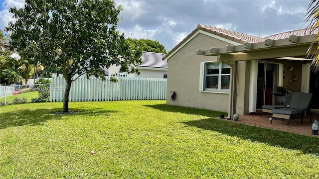 view of yard with a patio and a fenced backyard