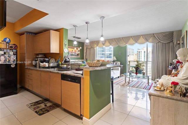 kitchen featuring light tile patterned floors, dishwashing machine, a peninsula, and a sink