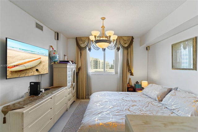 bedroom featuring visible vents, light carpet, and an inviting chandelier