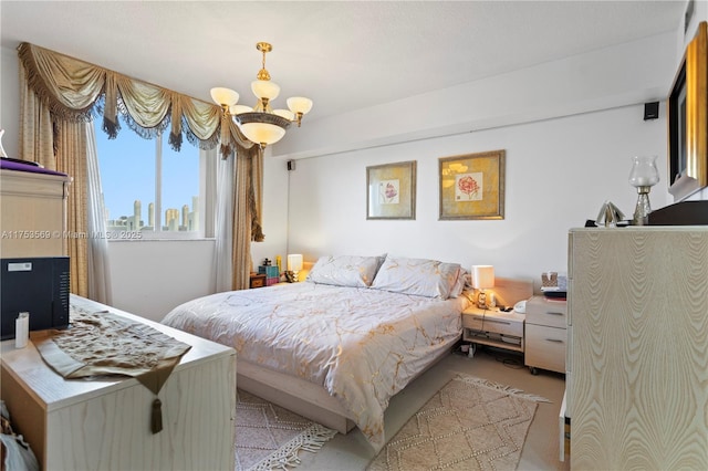 bedroom featuring a city view, light colored carpet, and a chandelier