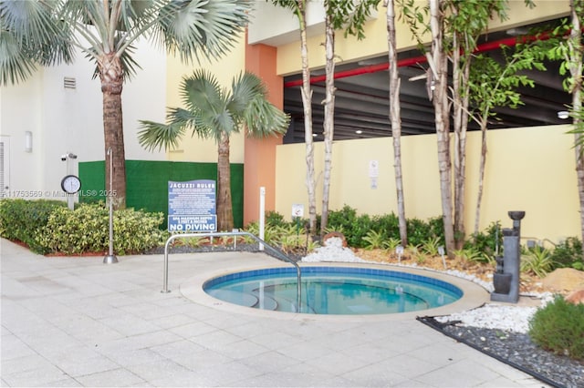 view of pool with a community hot tub