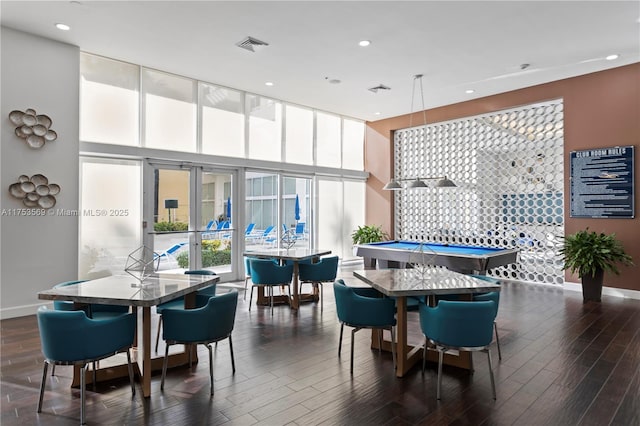 dining area featuring baseboards, a high ceiling, dark wood finished floors, and billiards