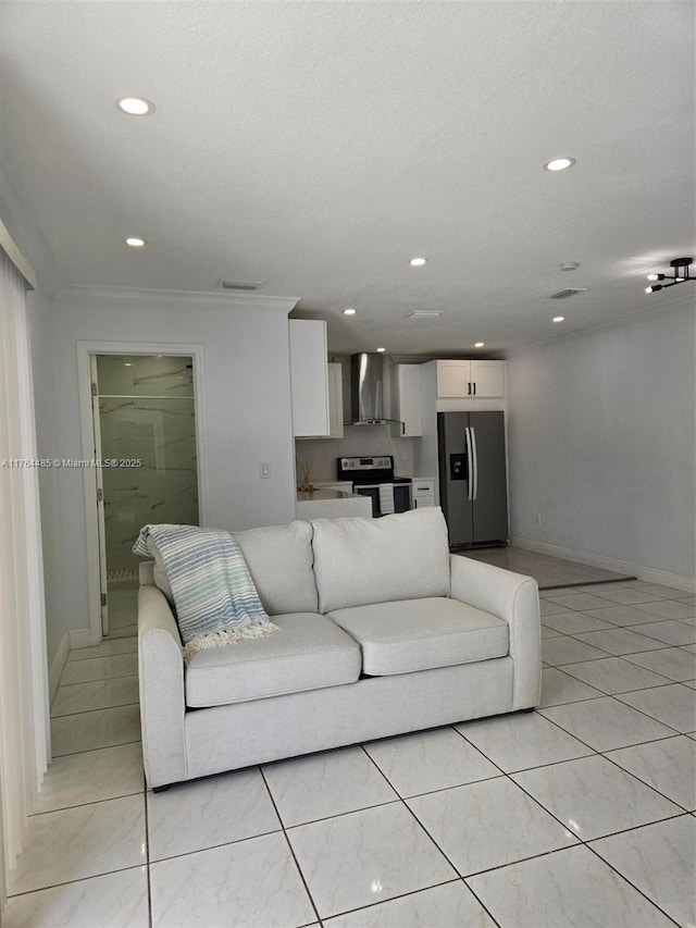 living room with visible vents, recessed lighting, baseboards, and a textured ceiling