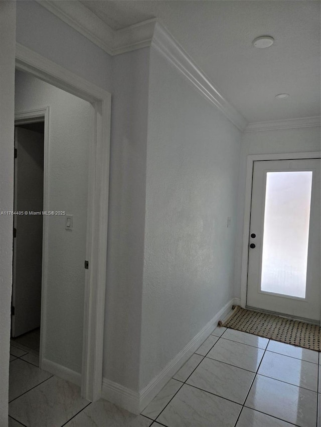 corridor with crown molding, light tile patterned floors, and baseboards