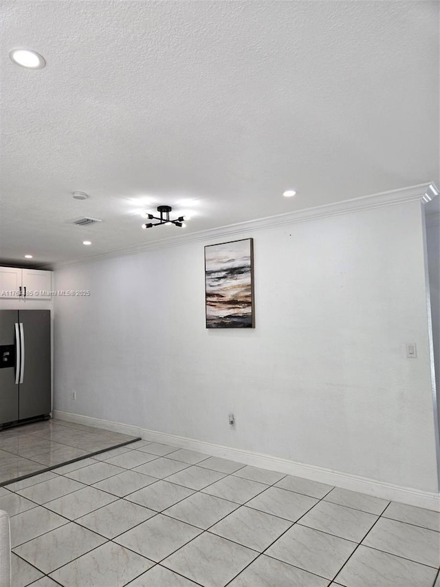 unfurnished room with crown molding, recessed lighting, baseboards, and a textured ceiling