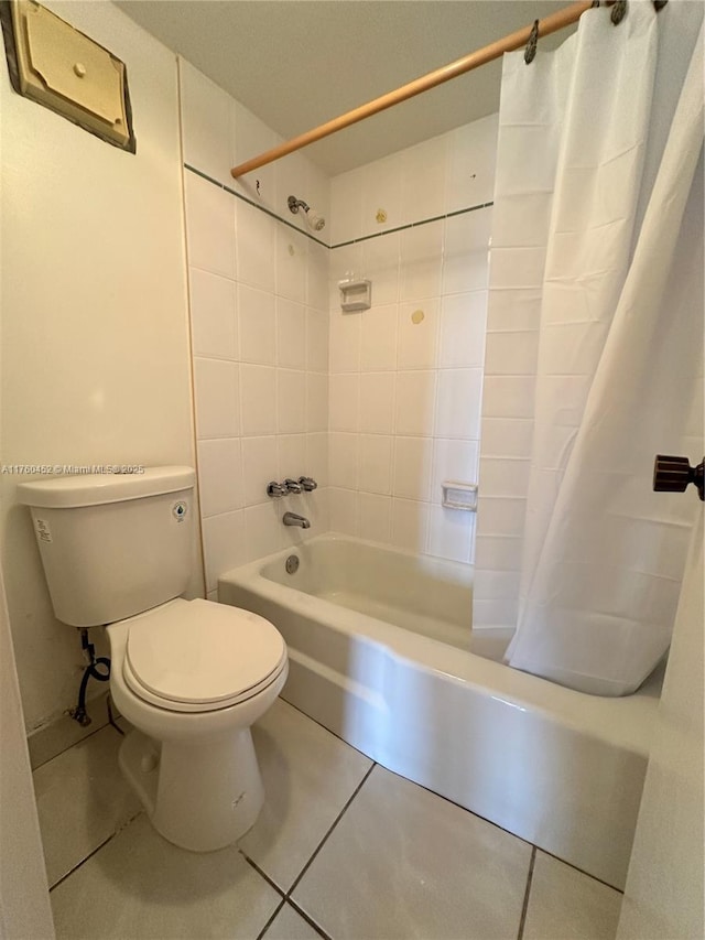 full bath with tile patterned floors, toilet, and shower / bathtub combination with curtain