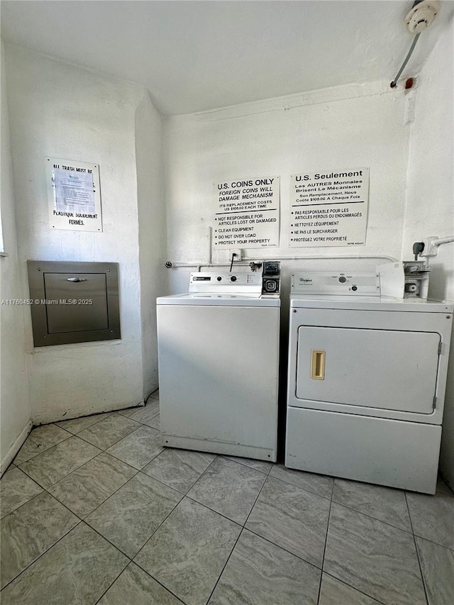 common laundry area with independent washer and dryer