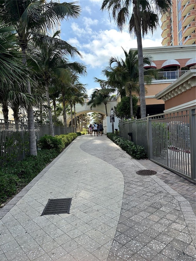 view of property's community featuring fence