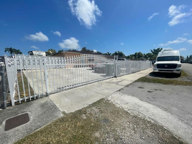 view of gate featuring fence