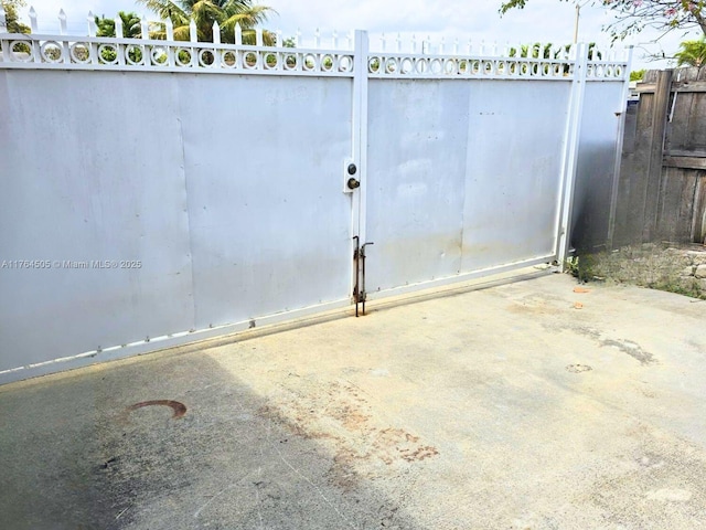 view of gate featuring fence