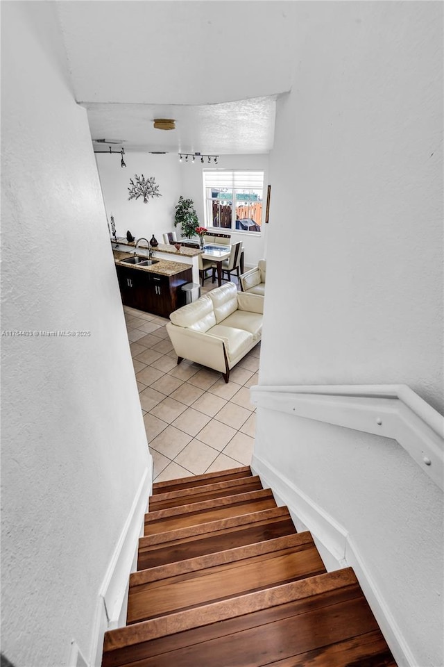 staircase with wood finished floors