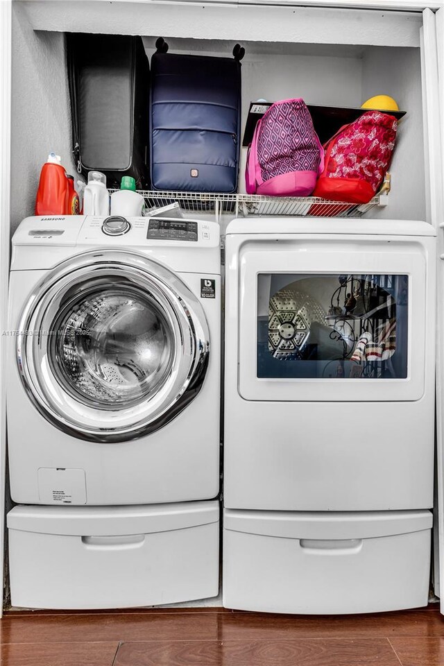 washroom with laundry area and wood finished floors