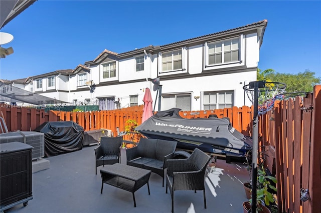 view of patio / terrace with an outdoor living space and fence