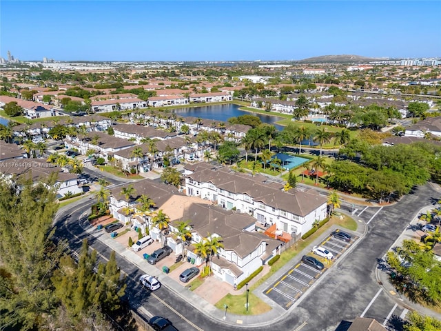 bird's eye view with a residential view and a water view