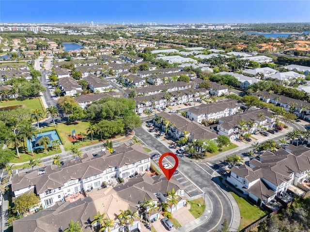 bird's eye view featuring a residential view and a water view