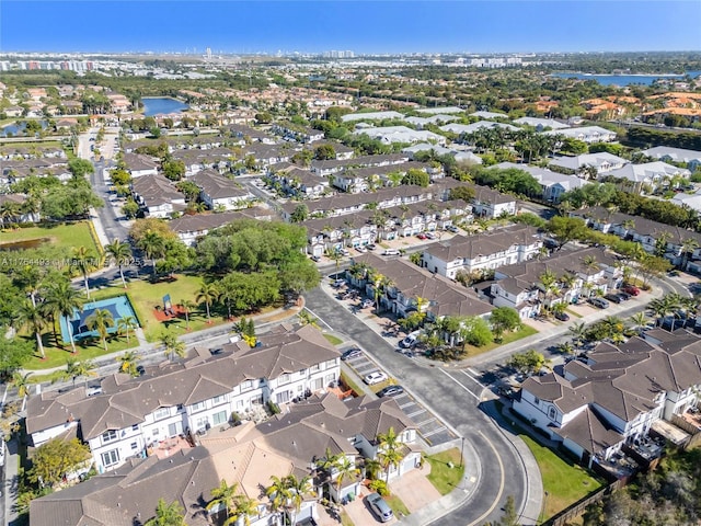 drone / aerial view with a residential view and a water view