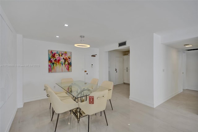 dining space featuring visible vents and baseboards