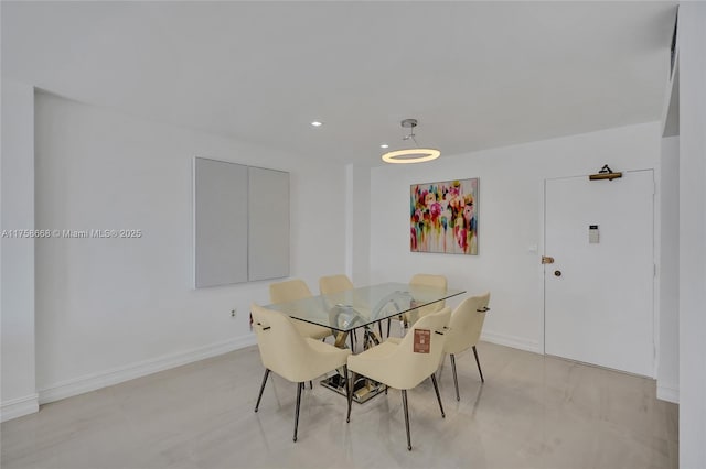 dining room with recessed lighting and baseboards