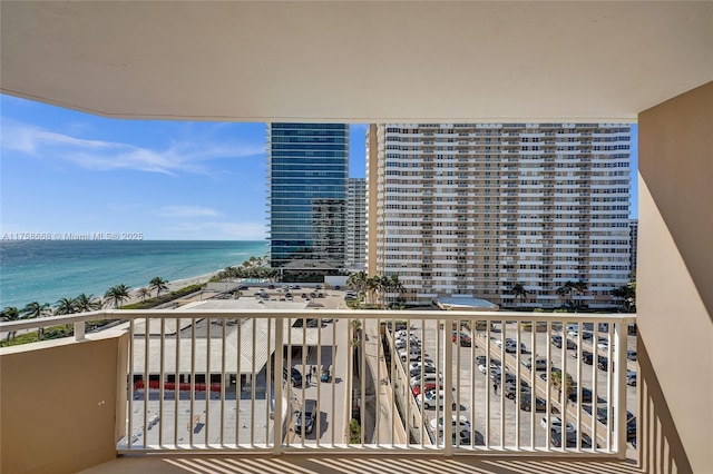 balcony featuring a view of city and a water view