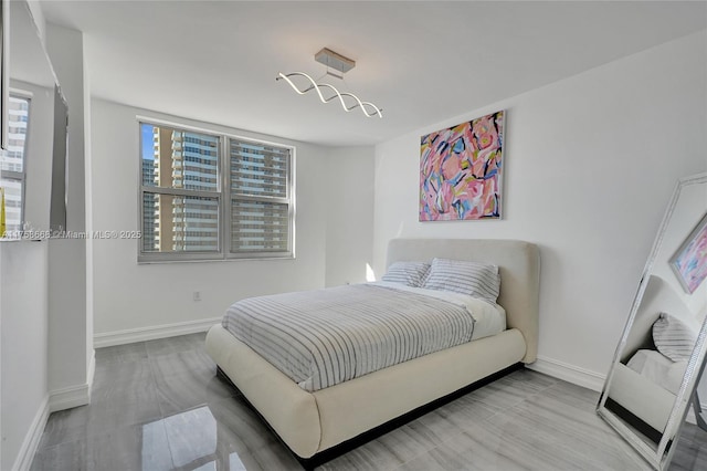 bedroom featuring baseboards