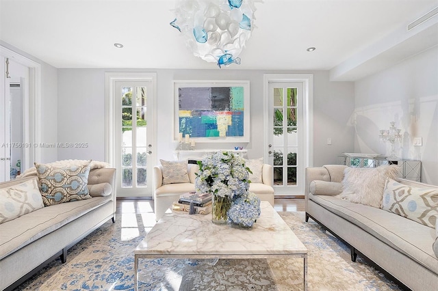 living area with recessed lighting and visible vents